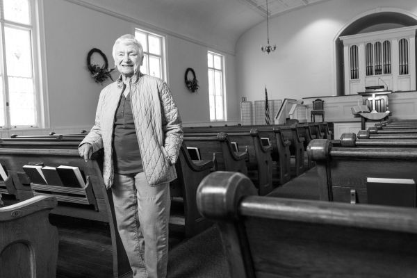 Woman standing in church.
